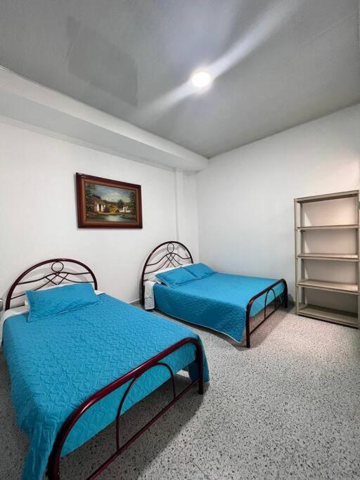 Postel nebo postele na pokoji v ubytování Home Acacias