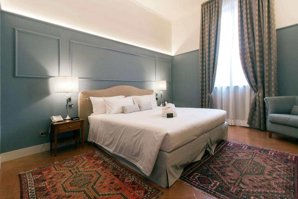 Postel nebo postele na pokoji v ubytování Grand Hotel Villa Torretta, Curio Collection by Hilton