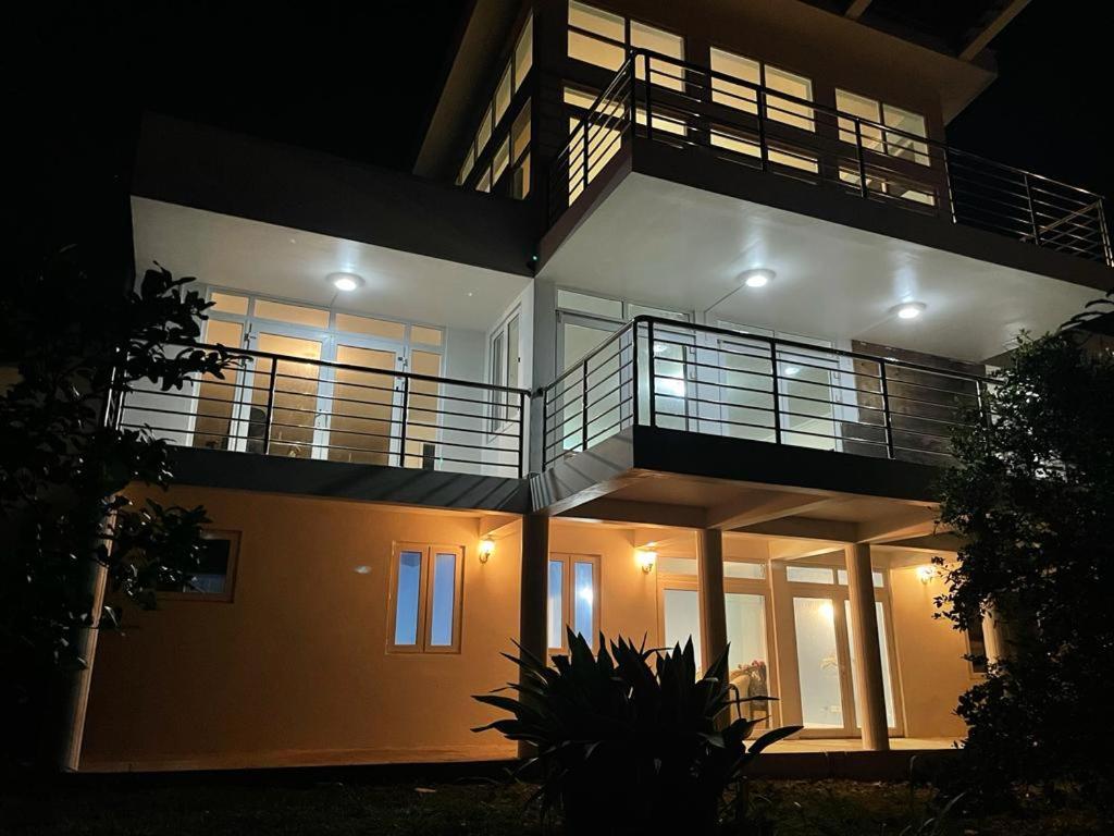 a large house with a balcony on top of it at Raha Villas in Gros Islet