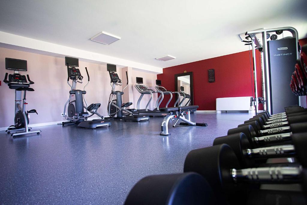 a gym with a bunch of chairs in a room at Hampton By Hilton Toulouse Airport in Blagnac