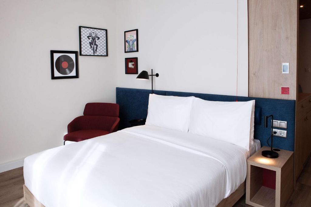 Postel nebo postele na pokoji v ubytování Hampton By Hilton Vienna Messe