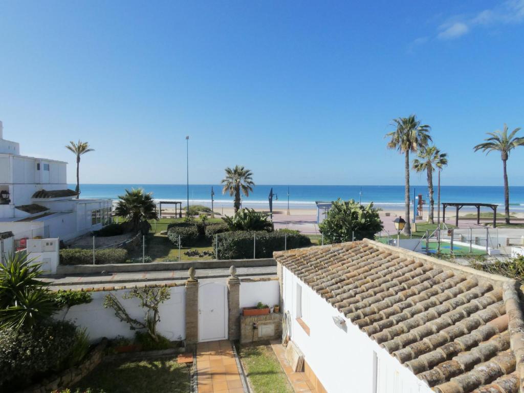 a view of the beach from a house at Chalet primera línea, La Barrosa in Chiclana de la Frontera