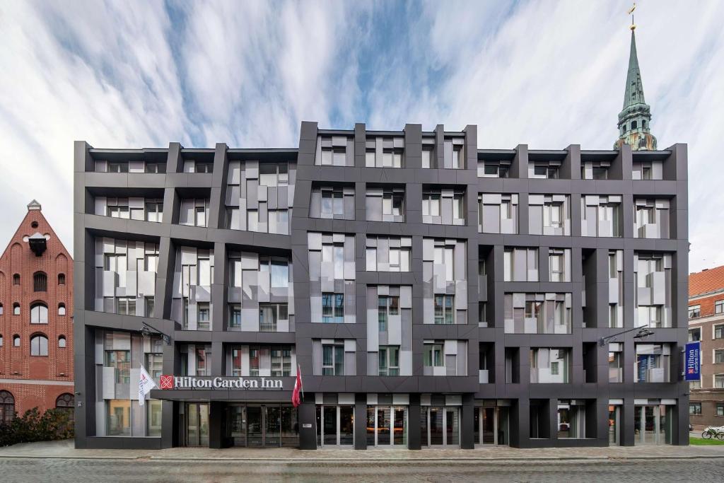 an architectural rendering of a building with a tower at Hilton Garden Inn Riga Old Town in Rīga