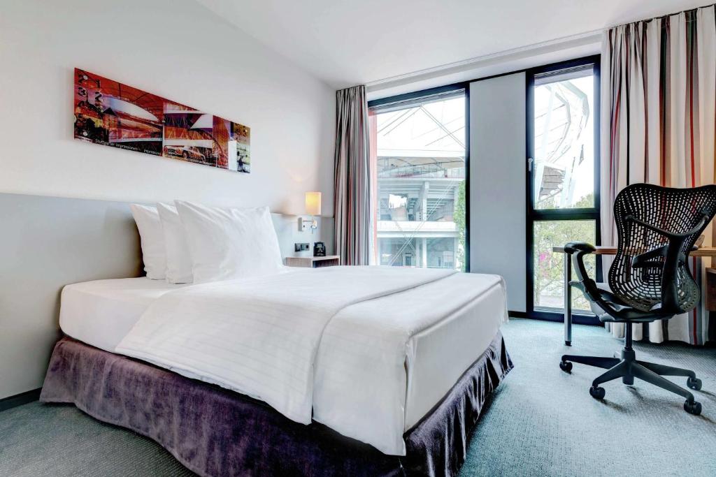 Postel nebo postele na pokoji v ubytování Hilton Garden Inn Stuttgart NeckarPark