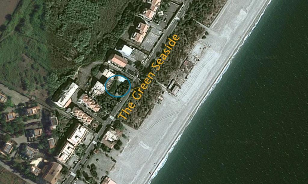 an aerial view of an island in the water at The Green Seaside in Fondachello