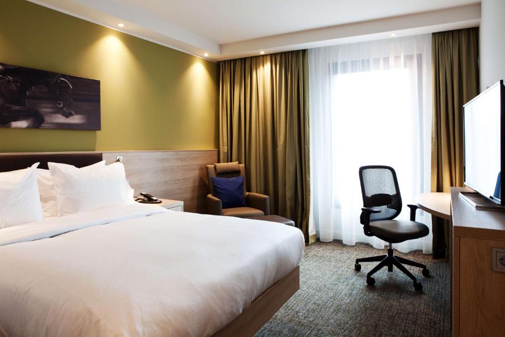 Postel nebo postele na pokoji v ubytování Hampton By Hilton Aachen Tivoli