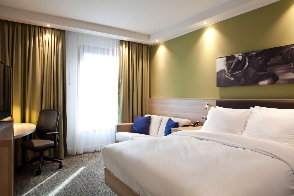 Postel nebo postele na pokoji v ubytování Hampton By Hilton Aachen Tivoli