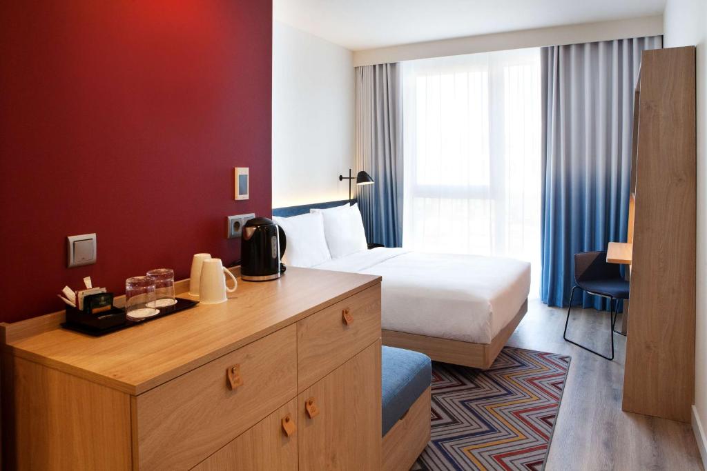 Cama o camas de una habitación en Hampton by Hilton Munich Airport South