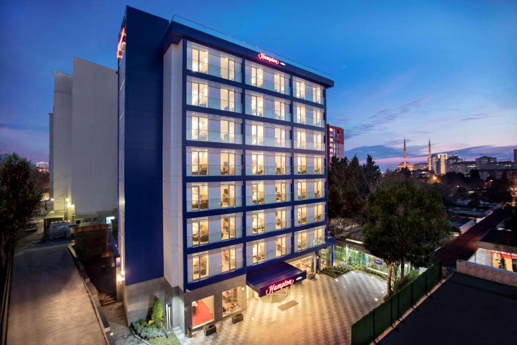an aerial view of a hotel at night at Hampton by Hilton Istanbul Atakoy in Istanbul