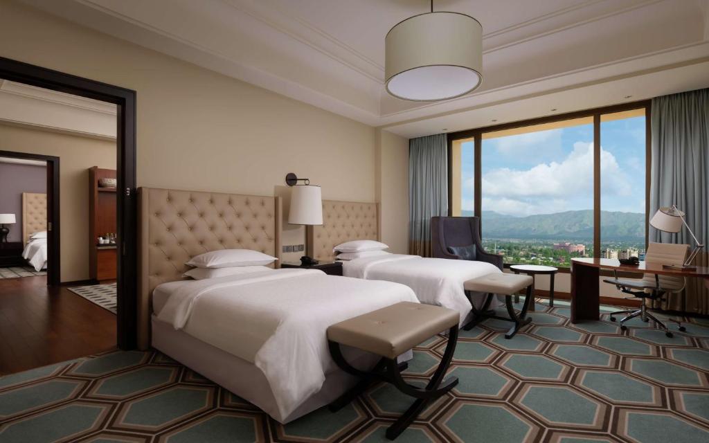 Postel nebo postele na pokoji v ubytování Hilton Dushanbe