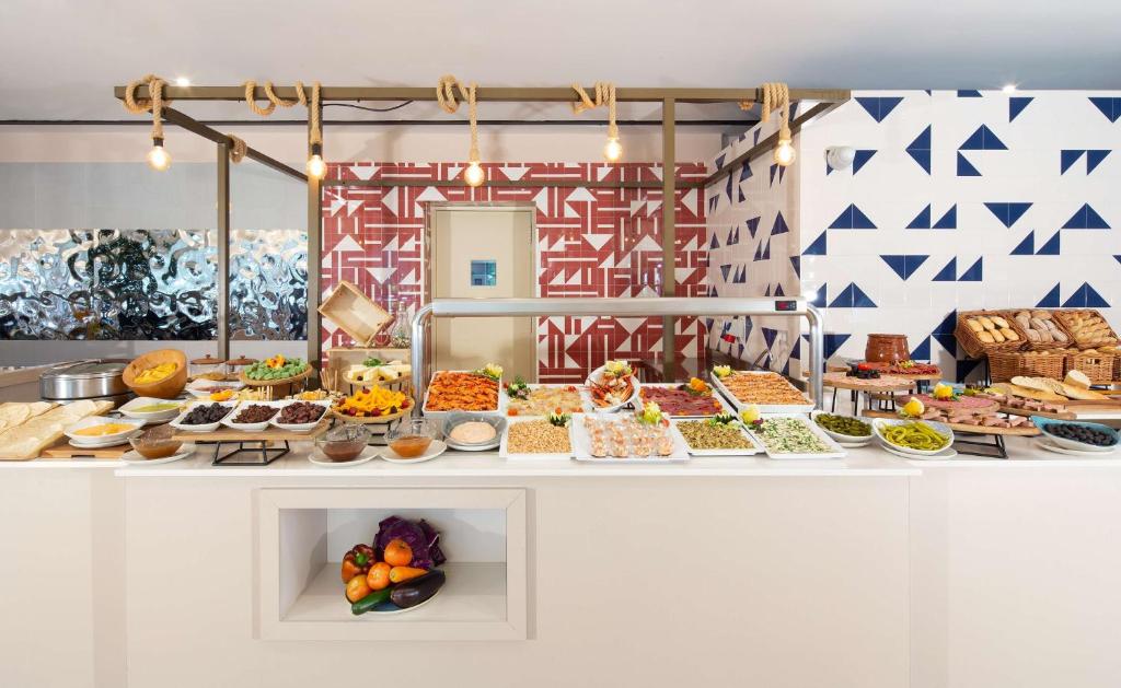 a buffet with many different types of food at DoubleTree by Hilton Islantilla Beach Golf Resort in Islantilla