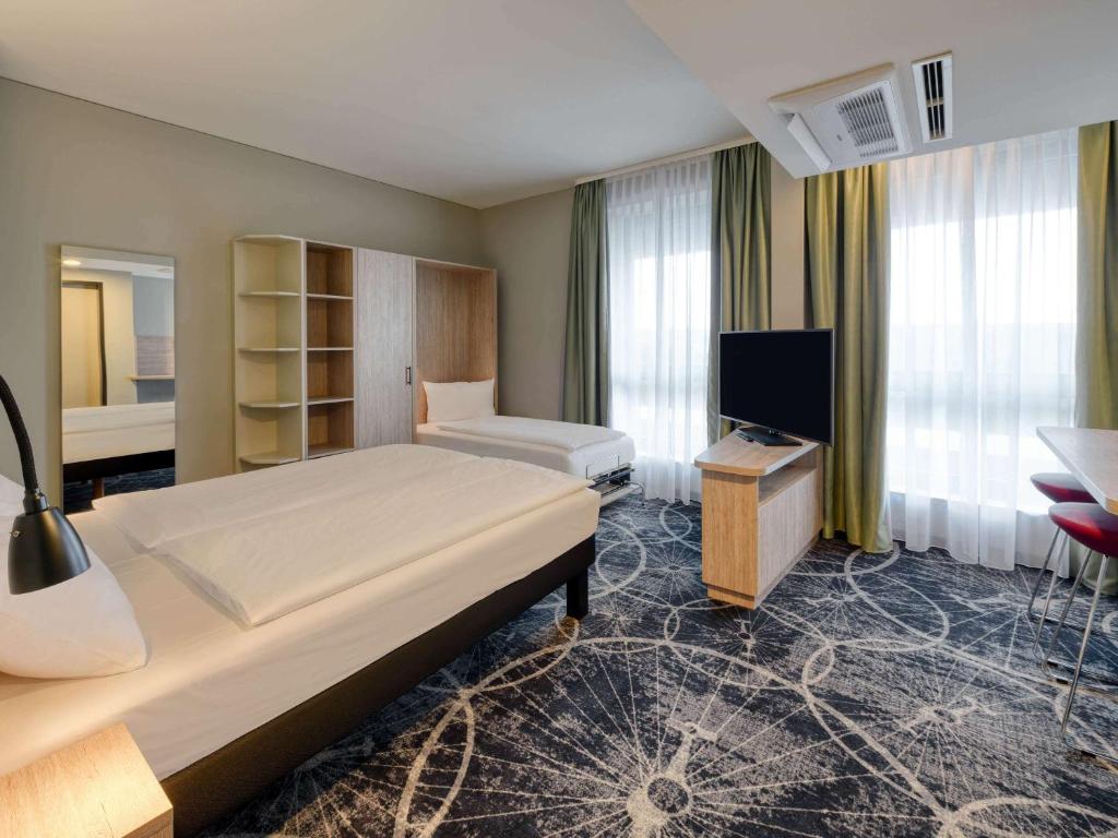 Postel nebo postele na pokoji v ubytování ibis Styles Magdeburg