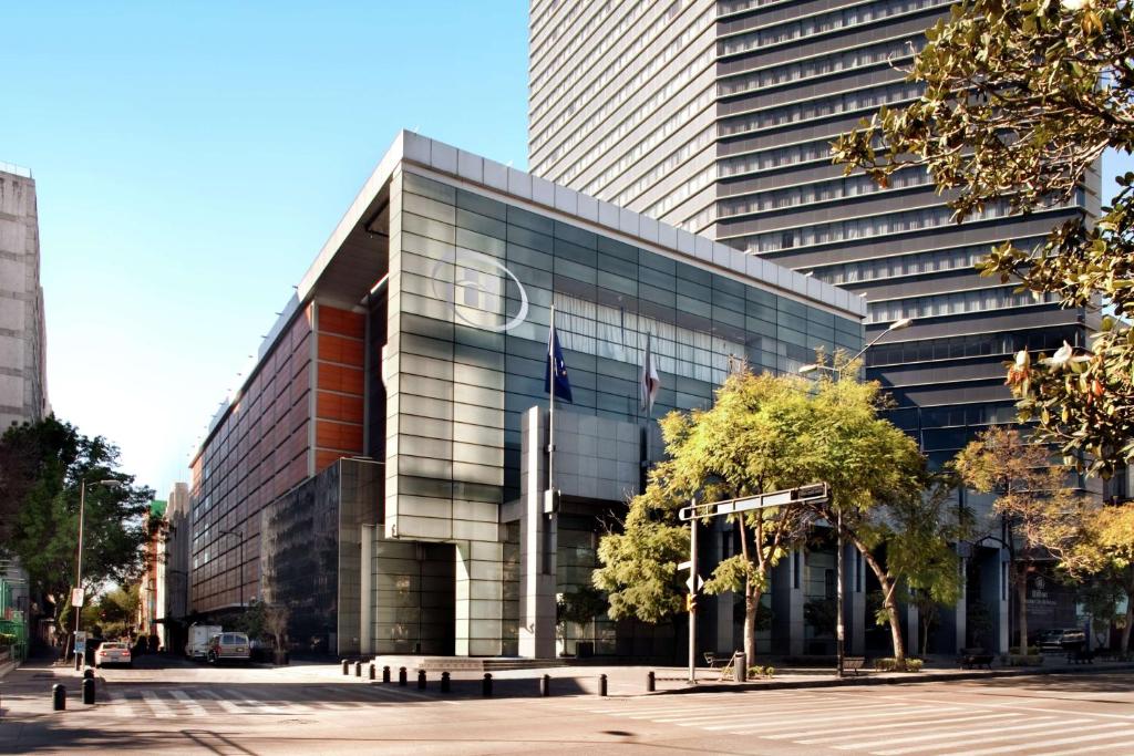 a large glass building with an apple logo on it at Hilton Mexico City Reforma in Mexico City