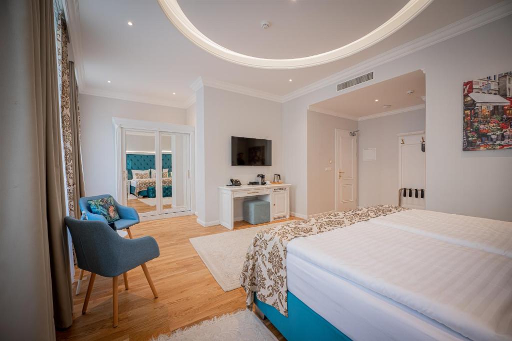 Voodi või voodid majutusasutuse Golden Key Boutique Hotel toas