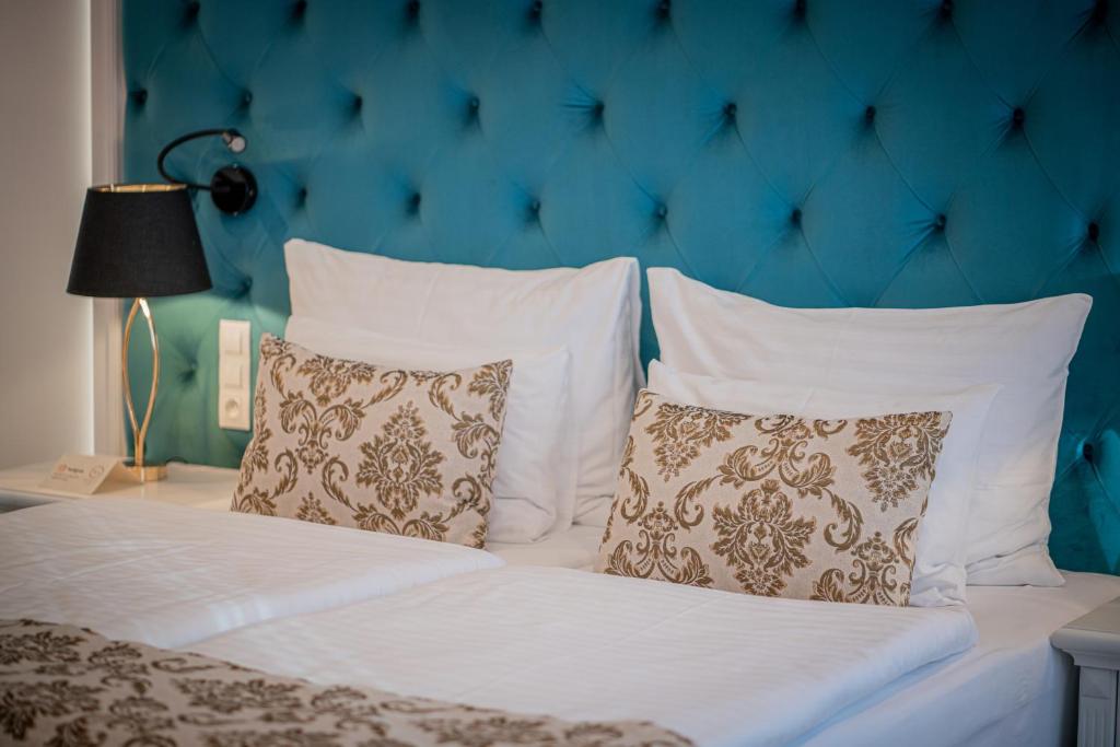 Voodi või voodid majutusasutuse Golden Key Boutique Hotel toas