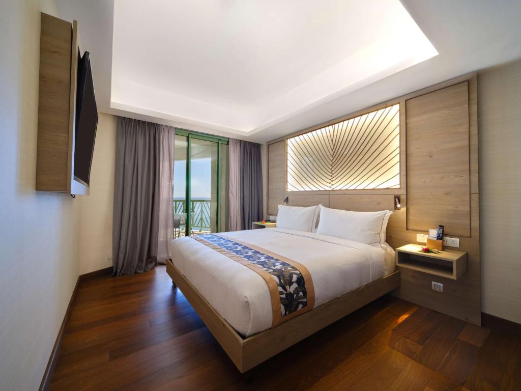 Postel nebo postele na pokoji v ubytování Hilton Hotel Tahiti