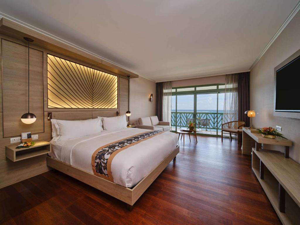 Postel nebo postele na pokoji v ubytování Hilton Hotel Tahiti