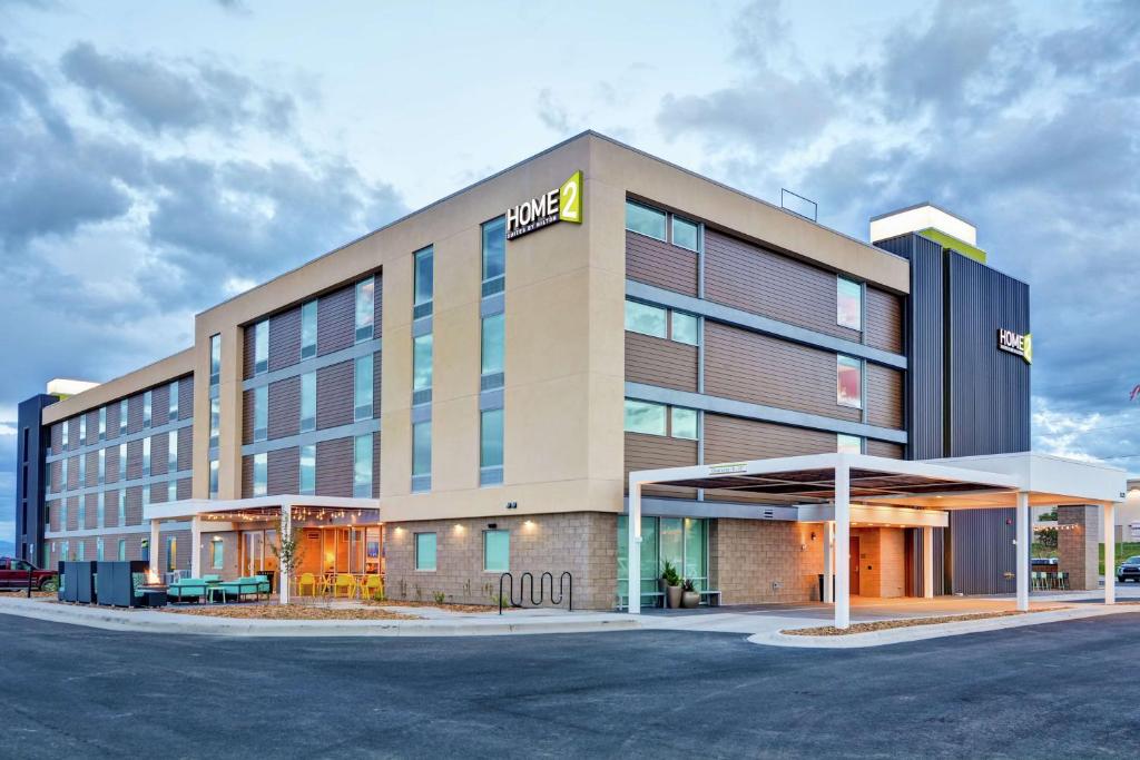 a hotel building with a sign on the front of it at Home2 Suites By Hilton Helena in Helena