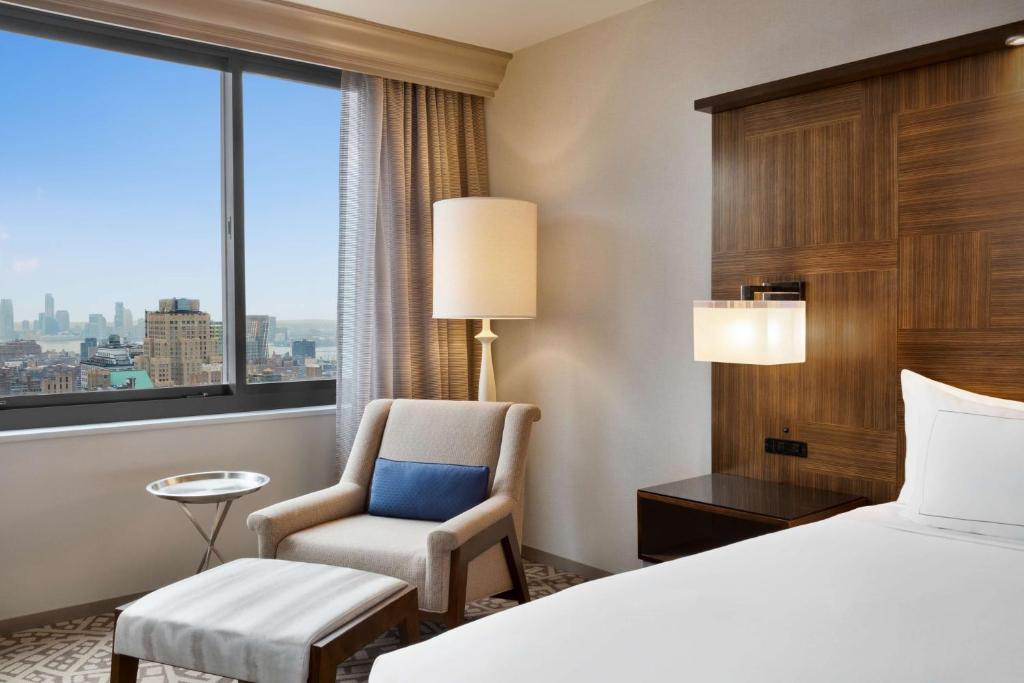 Cama ou camas em um quarto em Hilton New York Times Square