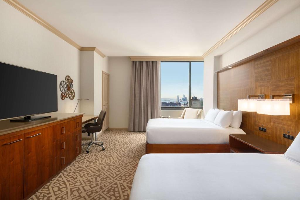 Cama ou camas em um quarto em Hilton New York Times Square