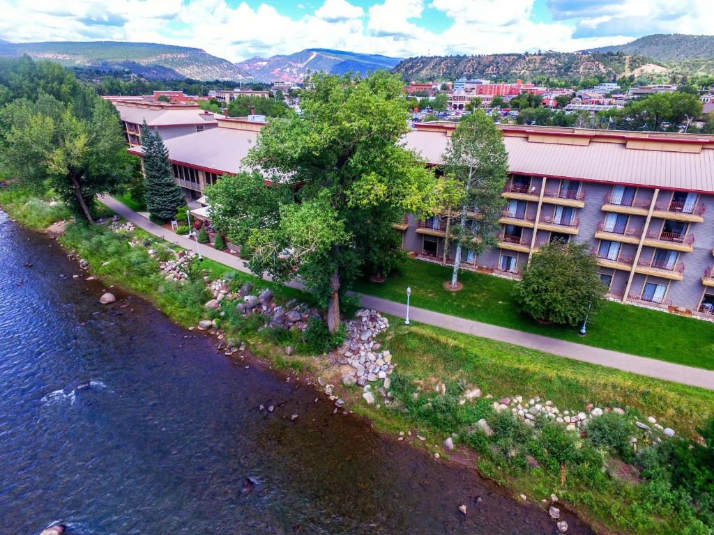 an aerial view of a building next to a river at DoubleTree by Hilton Durango in Durango