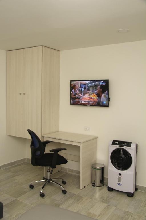 TV a/nebo společenská místnost v ubytování Almaviva Casa Hotel