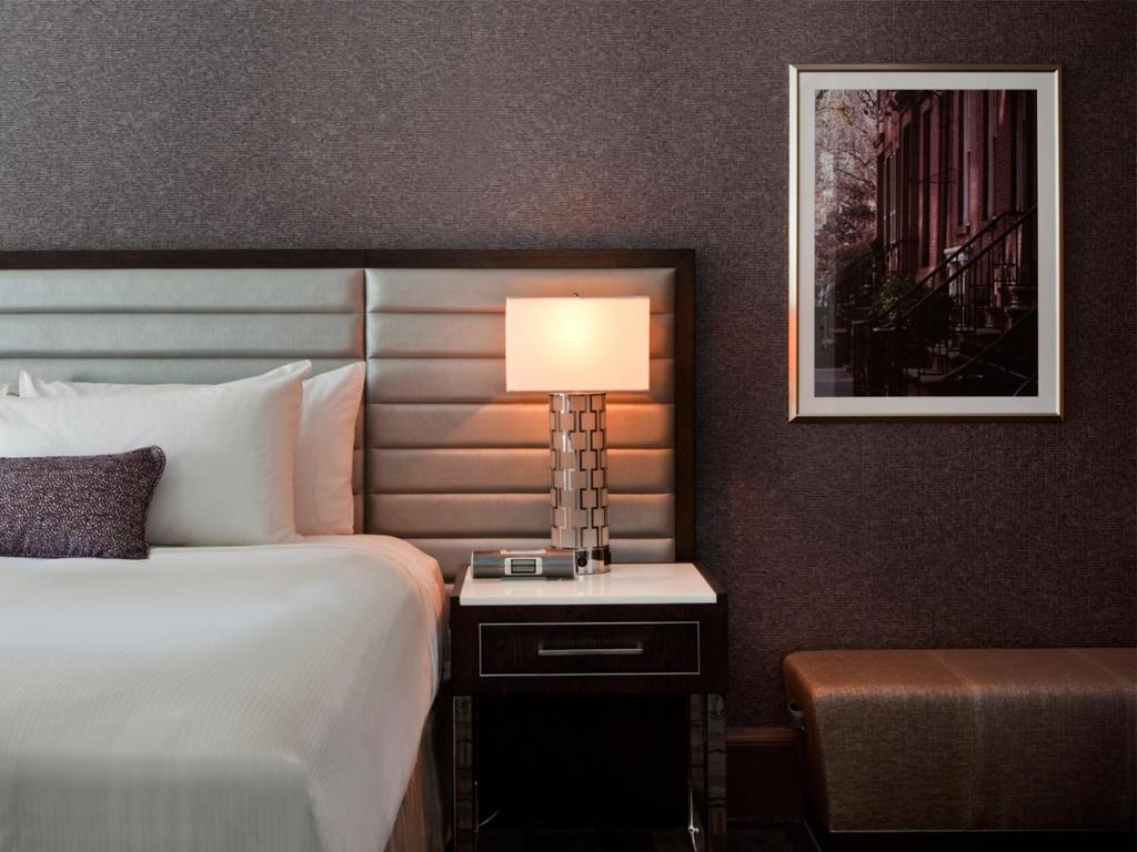 Ein Bett oder Betten in einem Zimmer der Unterkunft Park Central