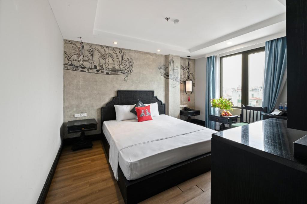 Postel nebo postele na pokoji v ubytování 22Land 52 Ngo Huyen Hotel & Spa