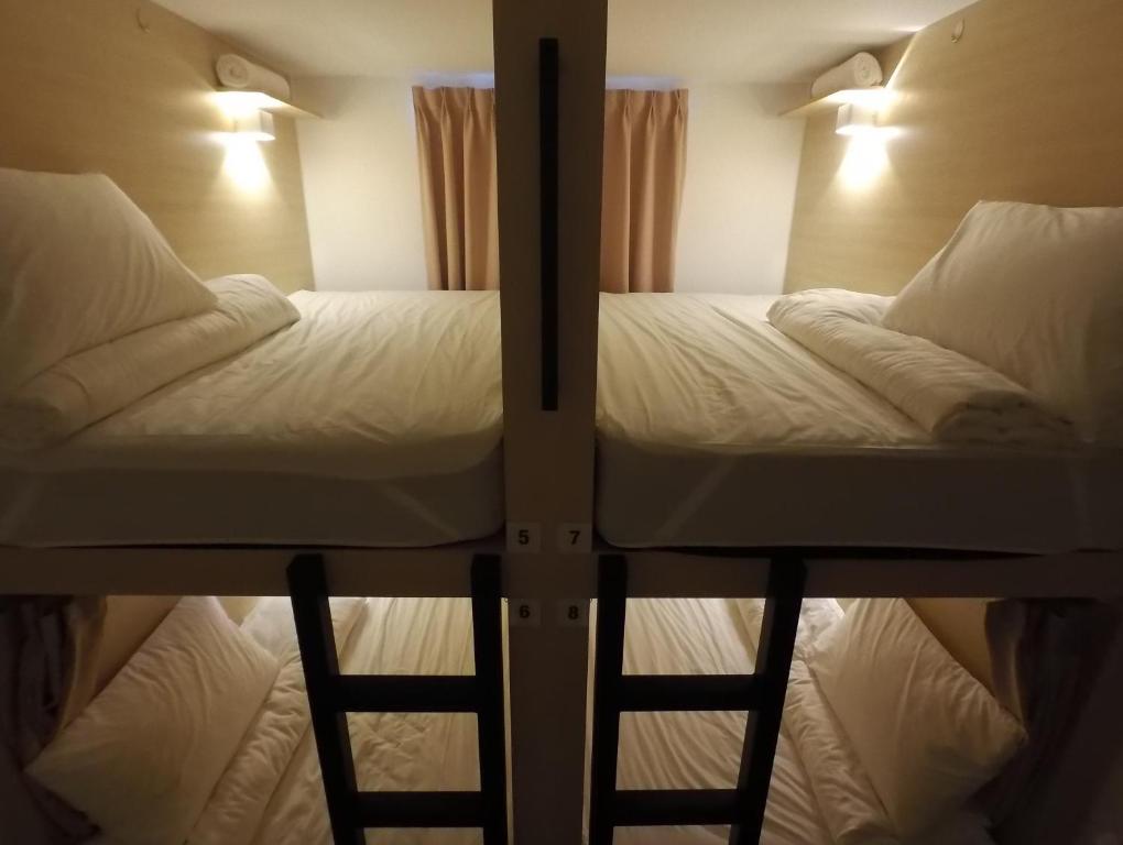 Postel nebo postele na pokoji v ubytování Signel Hostel