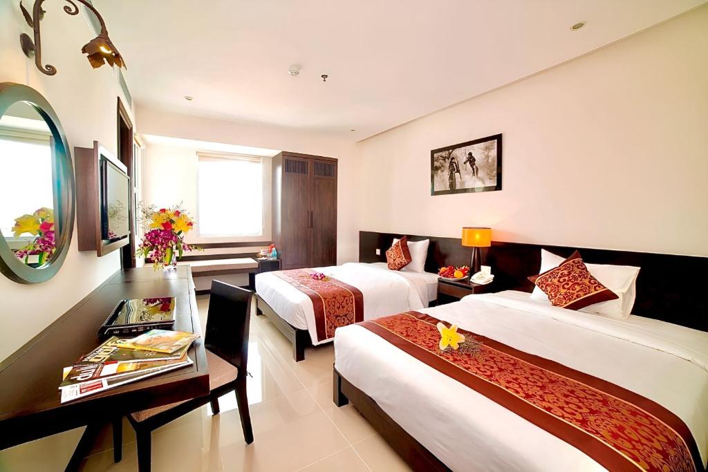 Postel nebo postele na pokoji v ubytování Edele Hotel Nha Trang Beach