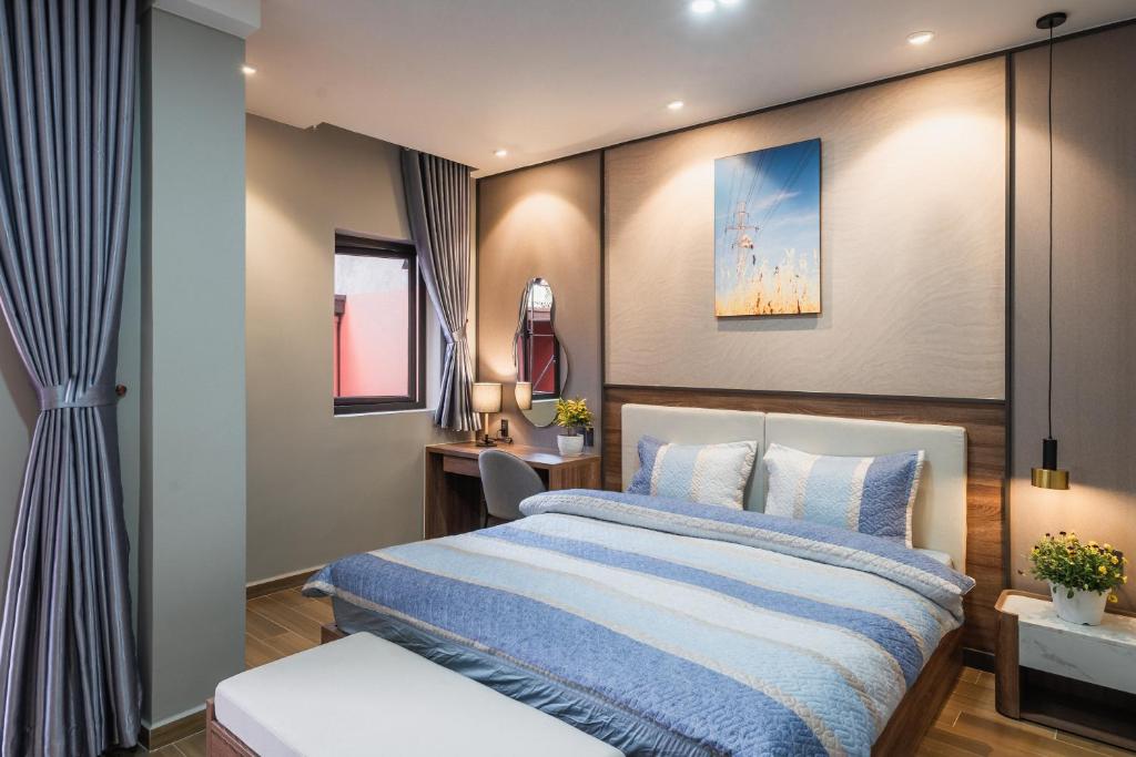 Giường trong phòng chung tại Thảo Nguyên House