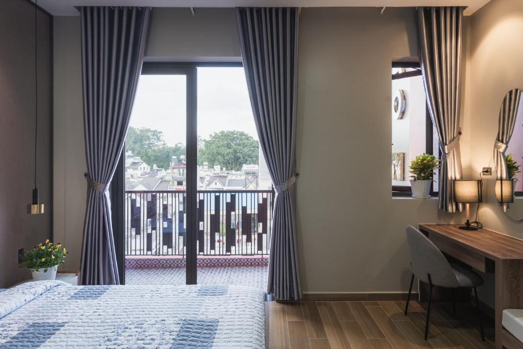 Giường trong phòng chung tại Thảo Nguyên House