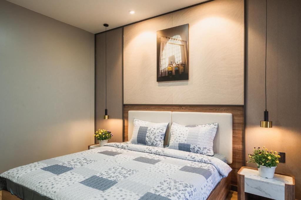 Giường trong phòng chung tại Thảo Nguyên House