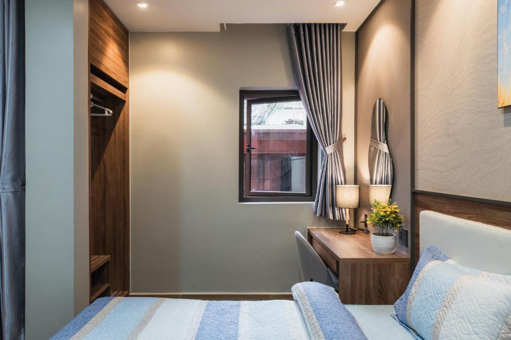 Giường trong phòng chung tại Thảo Nguyên House