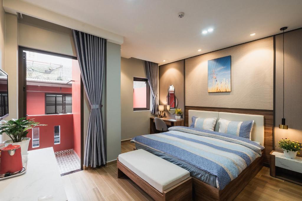 Giường trong phòng chung tại Thảo Nguyên House