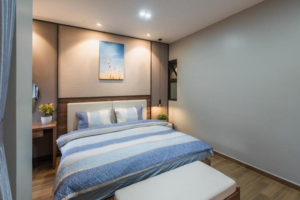 Giường trong phòng chung tại Thảo Nguyên House