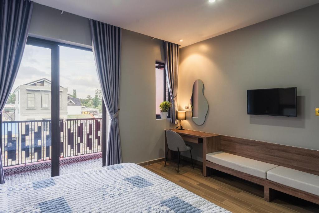 Giường trong phòng chung tại Thảo Nguyên House