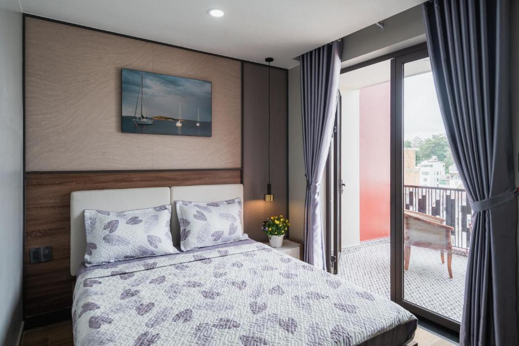 Giường trong phòng chung tại Thảo Nguyên House