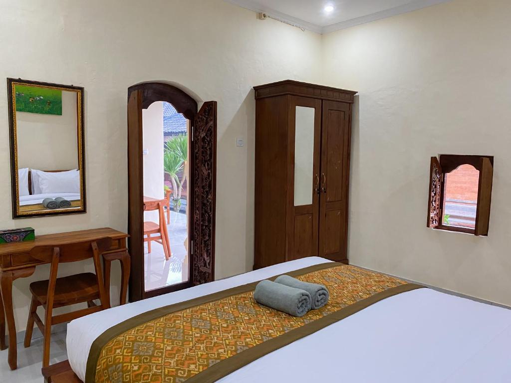 Postel nebo postele na pokoji v ubytování Bojig House Ubud