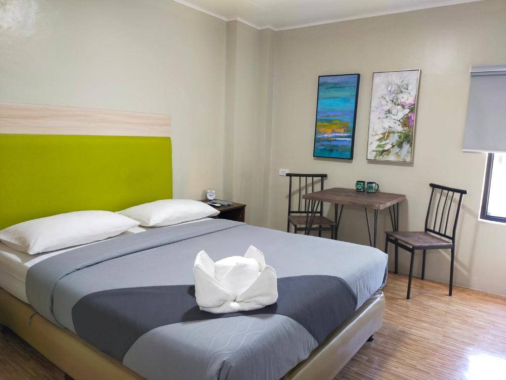 מיטה או מיטות בחדר ב-DG Budget Hotel Salem