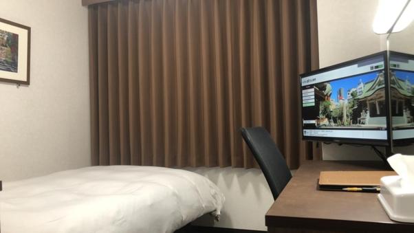 Postel nebo postele na pokoji v ubytování Hotel Alpha-One Kitashinsaibashi