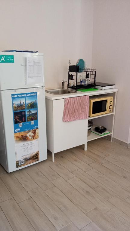 Kuchyň nebo kuchyňský kout v ubytování Verde Mare