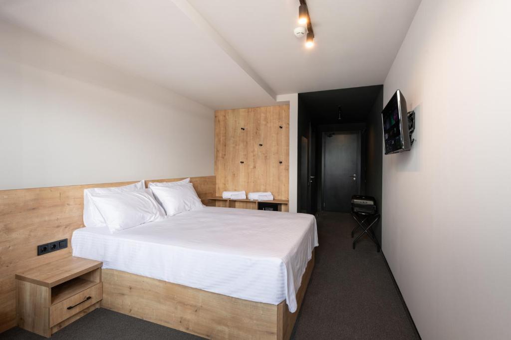 Ένα ή περισσότερα κρεβάτια σε δωμάτιο στο BET25 Hotel