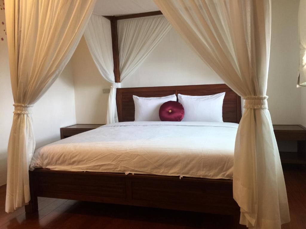 Postel nebo postele na pokoji v ubytování SunRise 23.5N B&B