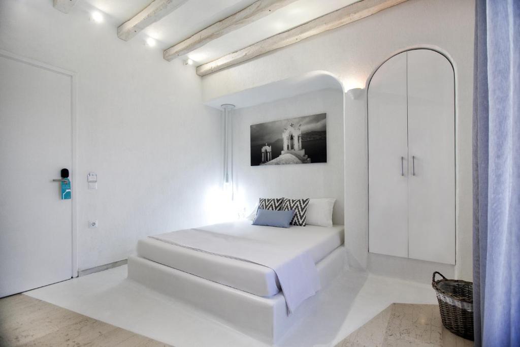 Postel nebo postele na pokoji v ubytování Privée Santorini