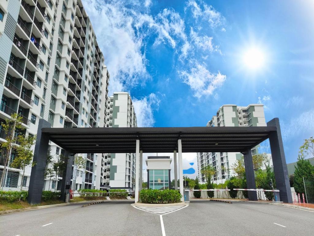 a parking lot in a city with tall buildings at Desaru Johor by Glex in Desaru