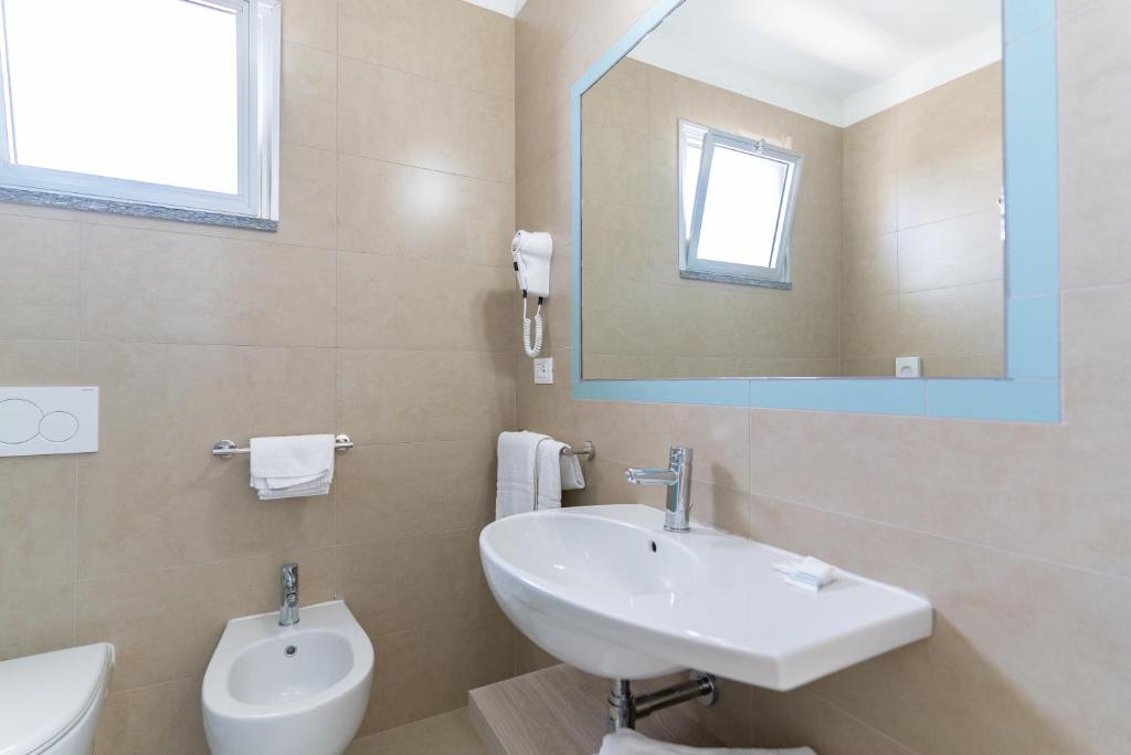 Koupelna v ubytování Hotel Concord