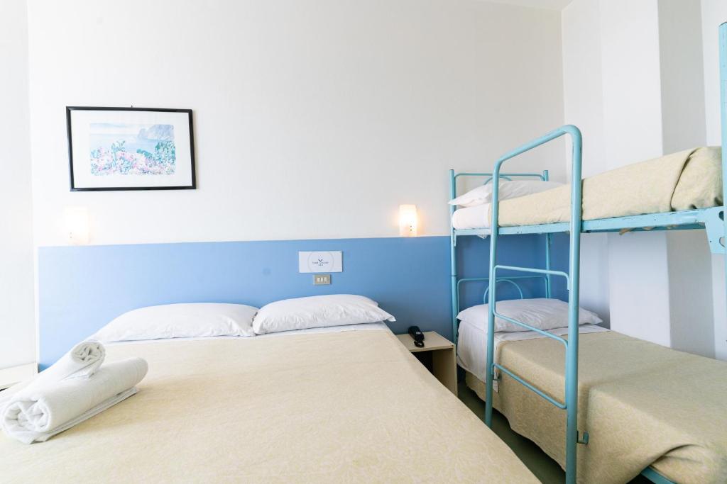 Postel nebo postele na pokoji v ubytování Hotel Concord