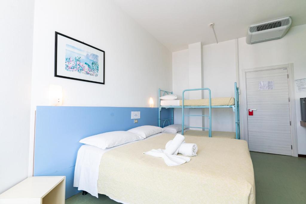 Postel nebo postele na pokoji v ubytování Hotel Concord