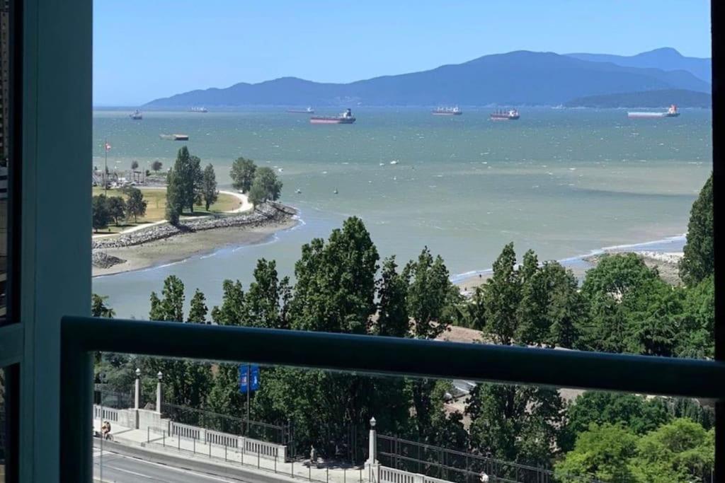 a view of a river from a window at Stunning ocean (sound of waves) in Vancouver